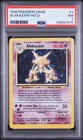 1999 POKEMON ALAKAZAM BASE SET HOLO 1/102 PSA 7