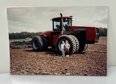 Photo of 2 Kids posing w/ 9170 Case International Tractor Farm Field Plowing