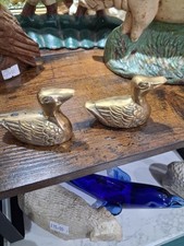 A Pair Of Brass Ducks.