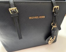 michael kors purse with brass trim in very go...