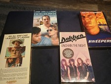 4 Different VHS Tapes.             1S