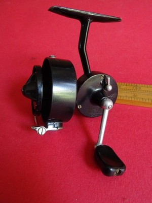 A GOOD USED VINTAGE MITCHELL CAP 304 LIGHT SPINNING REEL