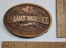 LARAMIE INSURANCE Company - belt BUCKLE - listing 7242