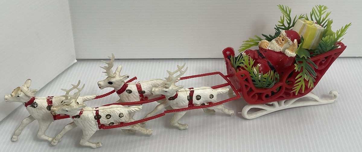 Vintage Plastic Waving Santa in Sleigh With Four White Gold