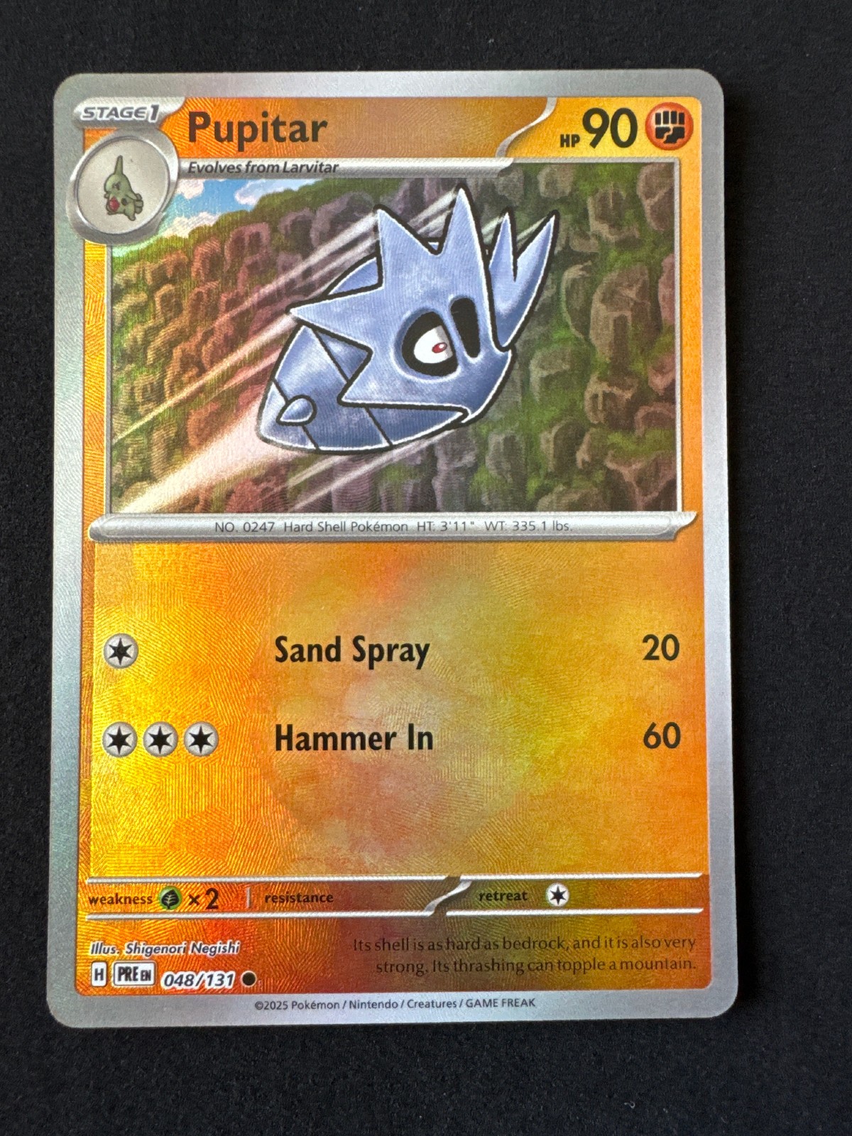 PUPITAR 048/131 NM COMMON POKE BALL PATTERN PRISMATIC EVOLUTIONS POKEMON 2025