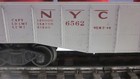 Lionel 6562 gray, NYC, gondola, red lettering w/4 red original canister load — photo 3