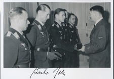 Gunther Rall signed 7X5 PHOTO receiving Oakleaves. Luftwaffe Ace. 275 kills!