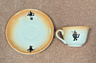 ANTIQUE 1920S FELIX THE CAT WITH RIFLE MATCHING COLOR CUP AND SAUCER