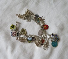 Silver charm bracelet,  22 charms -includes horse and sleigh, Cornish pixie etc.