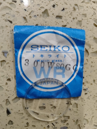 GENUINE SEIKO CRYSTAL 300W80GC SEIKO 4823 0843 3862 3863 5606 7546 6309 7019 NOS - Afbeelding 1 van 3
