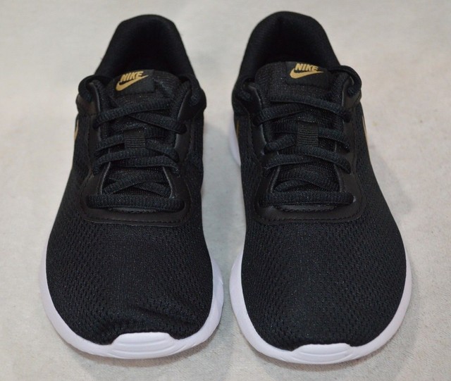 nike tanjun black gold