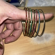 seven Enamel Bangle Bracelets With Gold Plated.