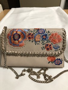 warm beige clutch bag