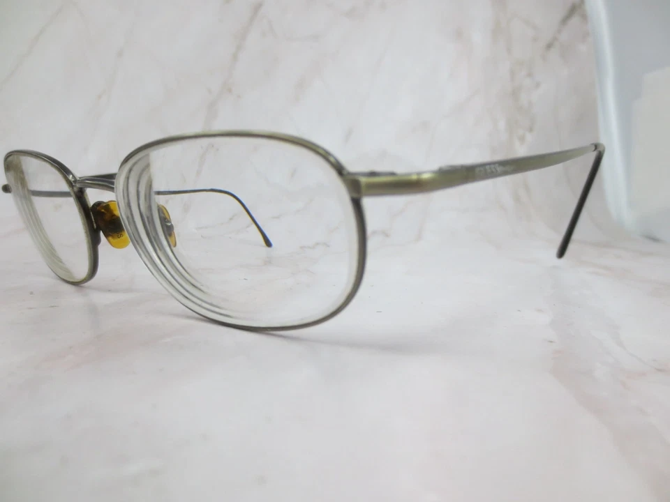 Marco de gafas Guess GU1142&CL para mujer plateado metal ovalado borde completo 52-18-145 Foto 2 de 4