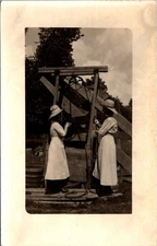 Women at Well in Light Dresses & Hats Pulley Rope & Bucket RPPC Postcard 32699