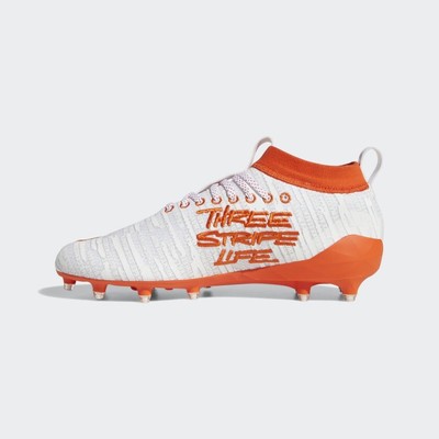 orange adidas cleats