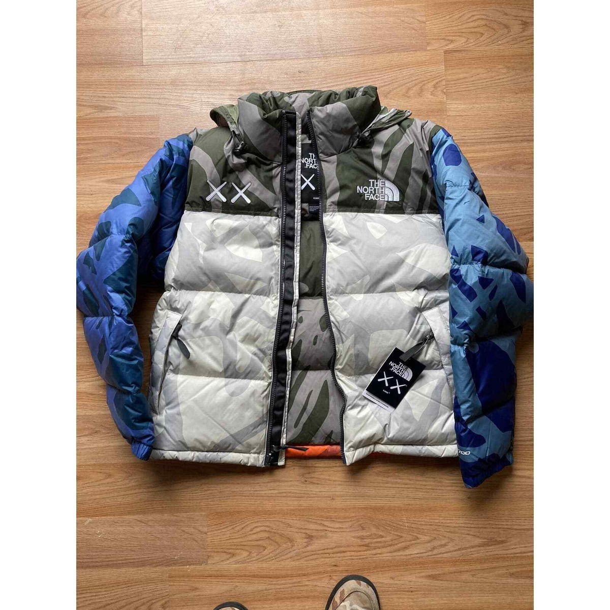 KAWS x TNF 1996 Nuptse The North Face Jacket Moonlight Ivory KAWS x TNF 1996 Nuptse The North Face Jacket Moonlight Ivory