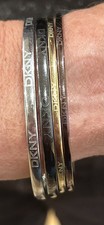 DKNY sets of four costume bangles multi colour