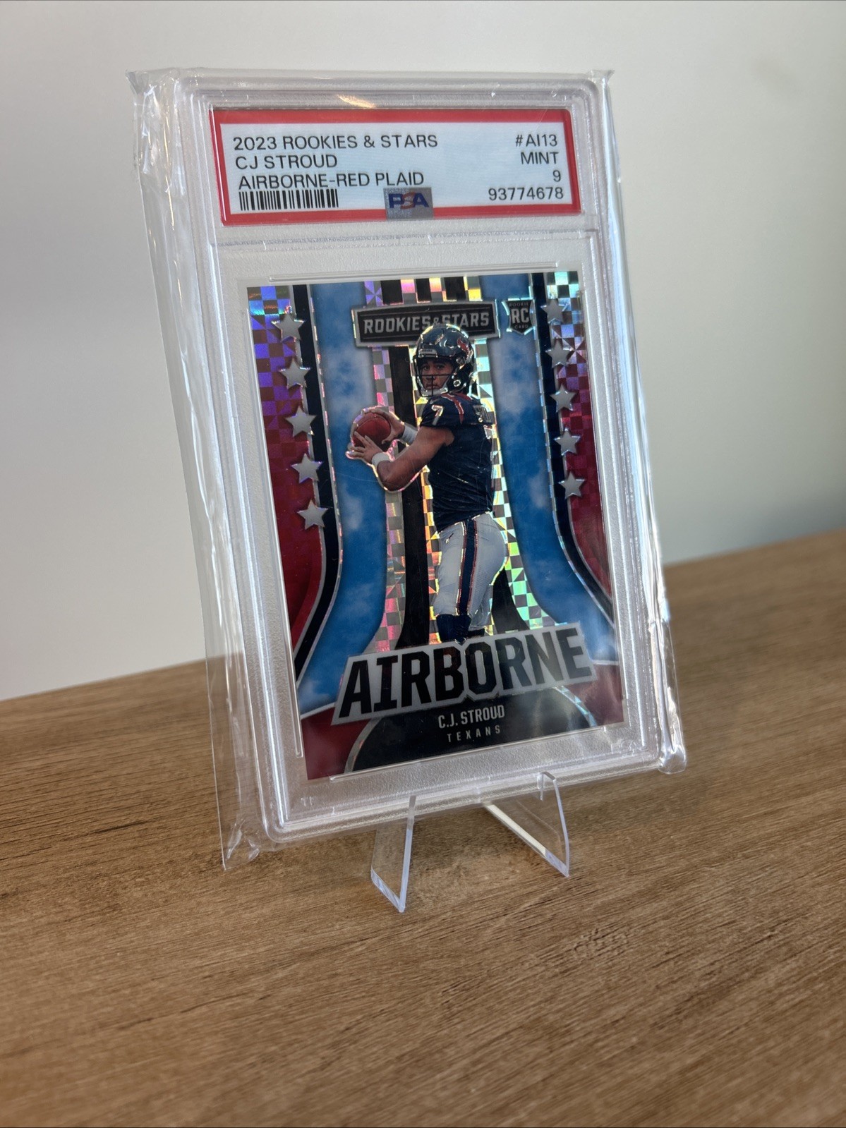 2023 Panini Rookies And Stars- CJ STROUD AIRBORNE-RED PLAID PSA MINT 9 TEXANS