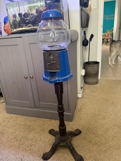vintage blue gumball machine on iron stand 3 feet tall in good condition