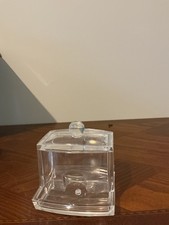 cotton swab Q-tip dispenser designed to hold swabs vertically.