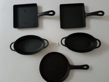 5 piece cast iron skillets Pioneer Woman and other 2 new and 3 others little use