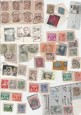 Mixed lot of used worldwide stamps, on paper