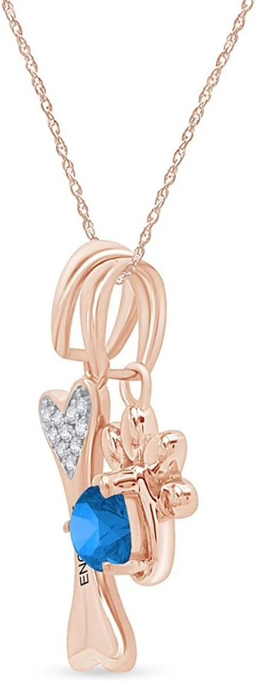 Colgante de topacio azul simulado con estampado de pata y hueso de perro en plata chapada en oro de 14 k Foto 2 de 4