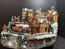 Weihnachtsszene Winterdorfszene mit fahrendem...