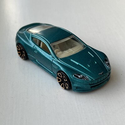 Hot Wheels Aston Martin DBS Metalflake Teal Gold FTE2 Faster Than Ever 1:64