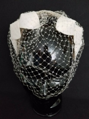 small hat with netting