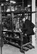 Man operates a hundred year old hand loom, location unspecified, U Old Photo