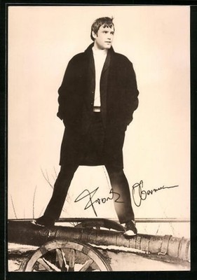 Postcard actor Frank Obermann wide-legged standing on a cannon 