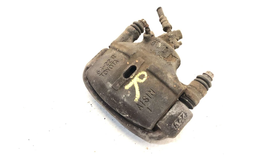 Pinza de freno delantera derecha Toyota Camry 1986 pasajero con soporte de montaje OEM Foto 3 de 4