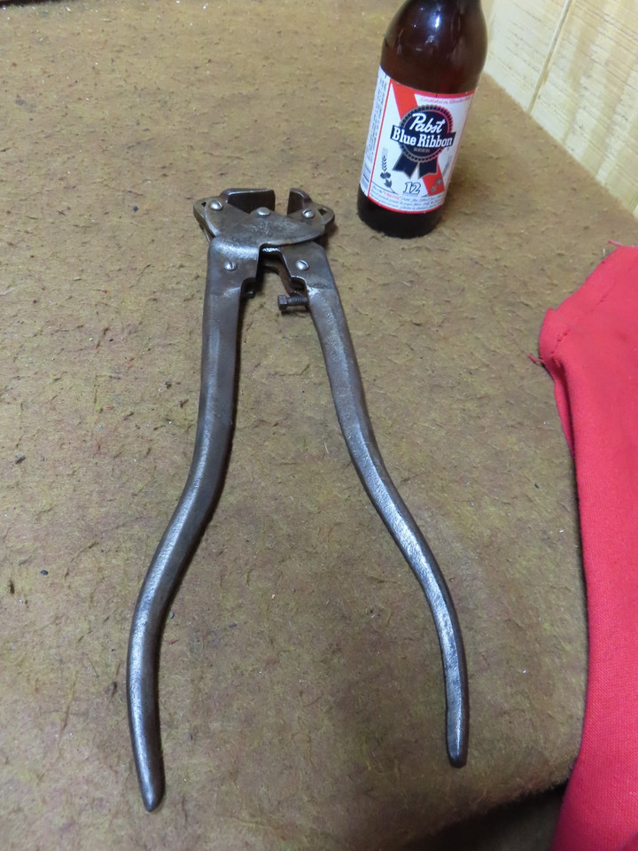 A patented vintage Champion farrier hoof nipper — a genuine piece of American trade history that doubles as a wild conversation-starting desk object.