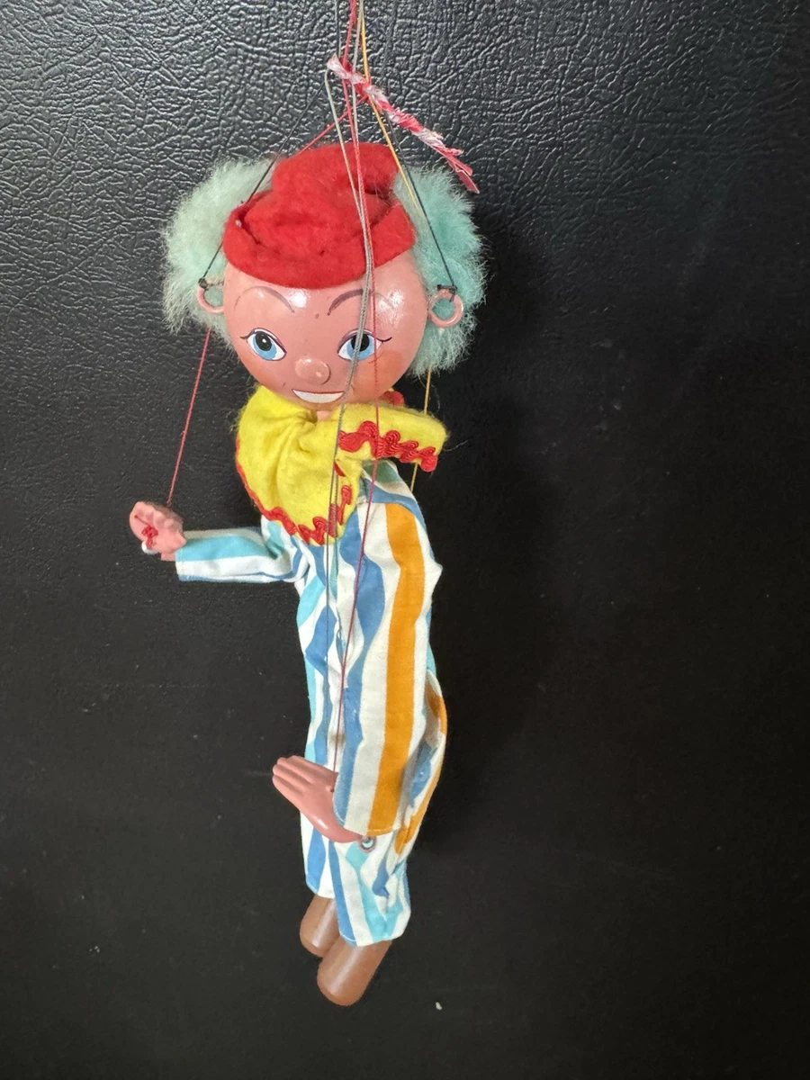 A vintage Pelham Puppet theatre along with five Pelham Puppets, one other marionette puppet, and