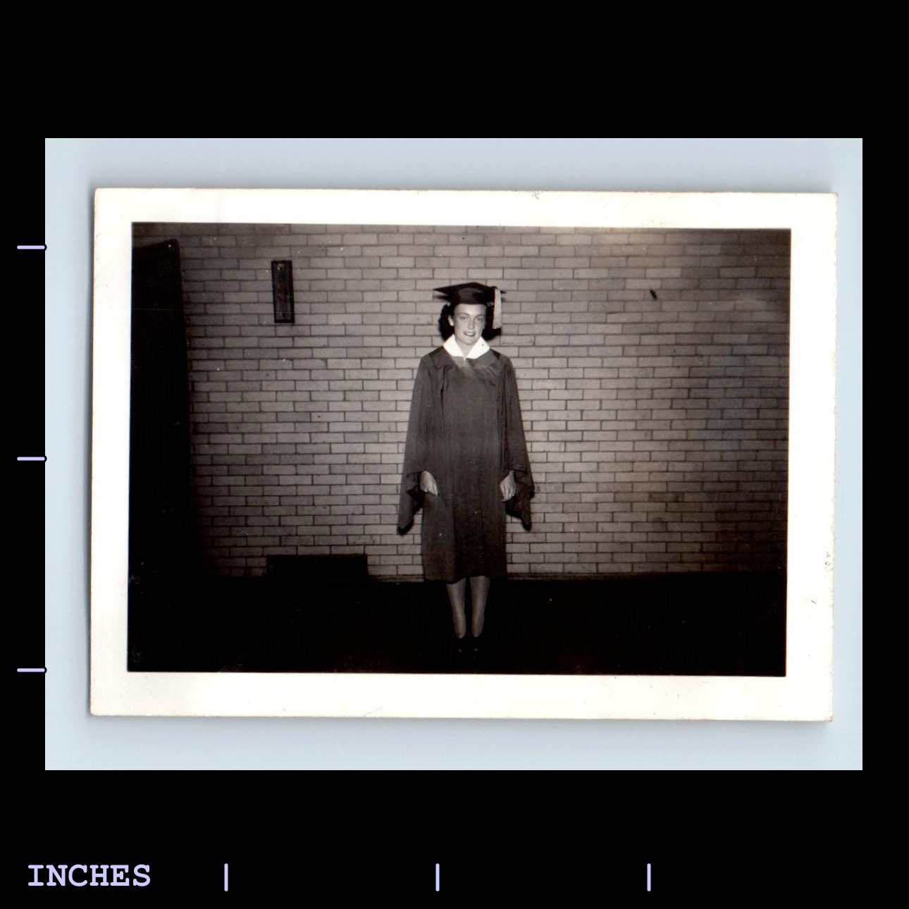 Vintage Black and White Photo of Woman in Graduation Cap and Gown