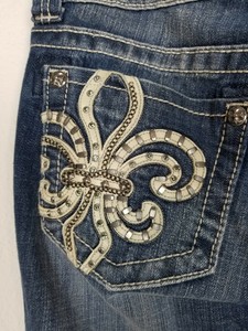 jeans with fleur de lis on pocket
