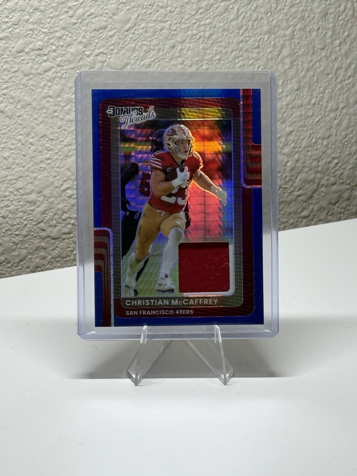 2025 Donruss Optic - Threads Christian McCaffrey #DTBH-CMY Blue Hyper Prizm (MEM
