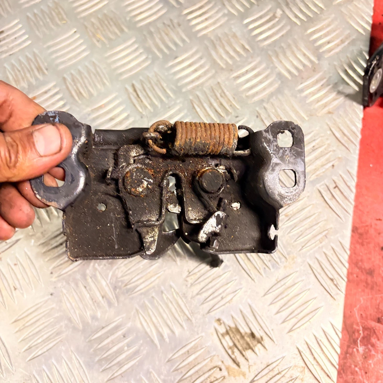 Dodge Caliber bonnet latch release mechanism