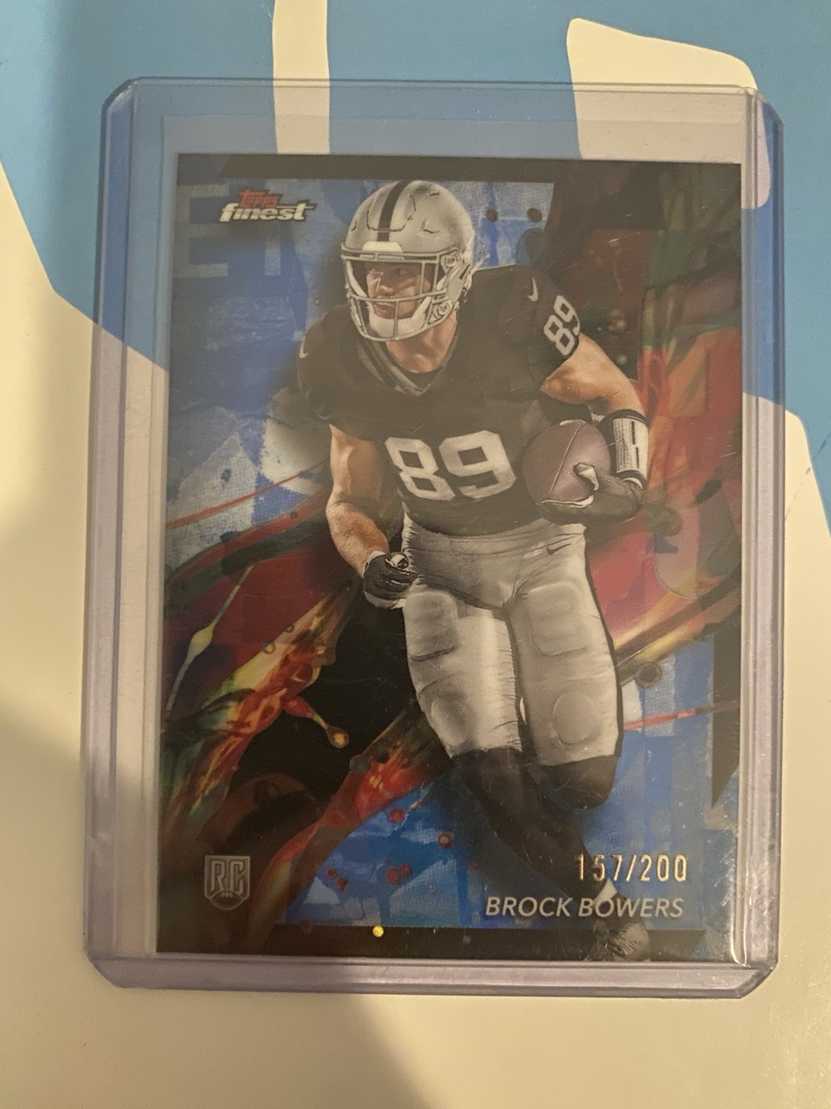 2024 Topps Finest - Common Brock Bowers #82 Blue Geometric Refractor /99 (RC)