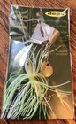 deps new MAD WAVER #10 Dead Grass color 5/8 oz bait in packaging with silver lure and green-white striped lure.