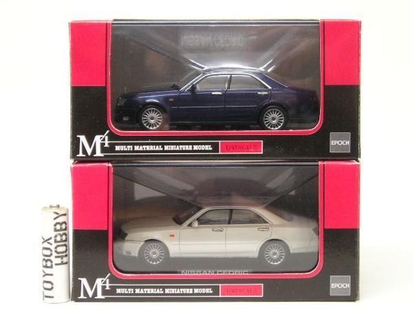 TB Epoch M-Tech 1/43 Nissan Cedric blanco y azul oscuro