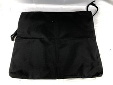 Black Fabric Storage Bag used as a car seat back organizer