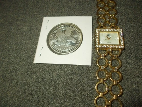 1 oz silver round SD Bullion & Free Watch ,Works good