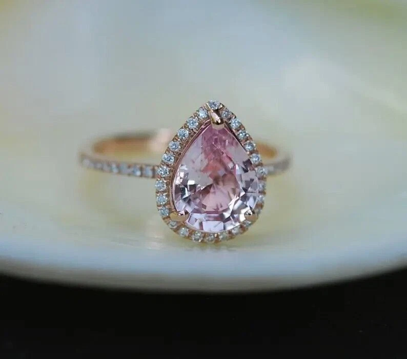 Pear shaped peach 2024 sapphire engagement rings