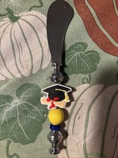 Couteau à beurre en perles artisanales pour quelqu'un diplômé du lycée