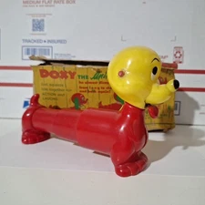 Vintage Doxy The Animated Dog Alladin Plastics Squeeze And Barks Red & Yellow