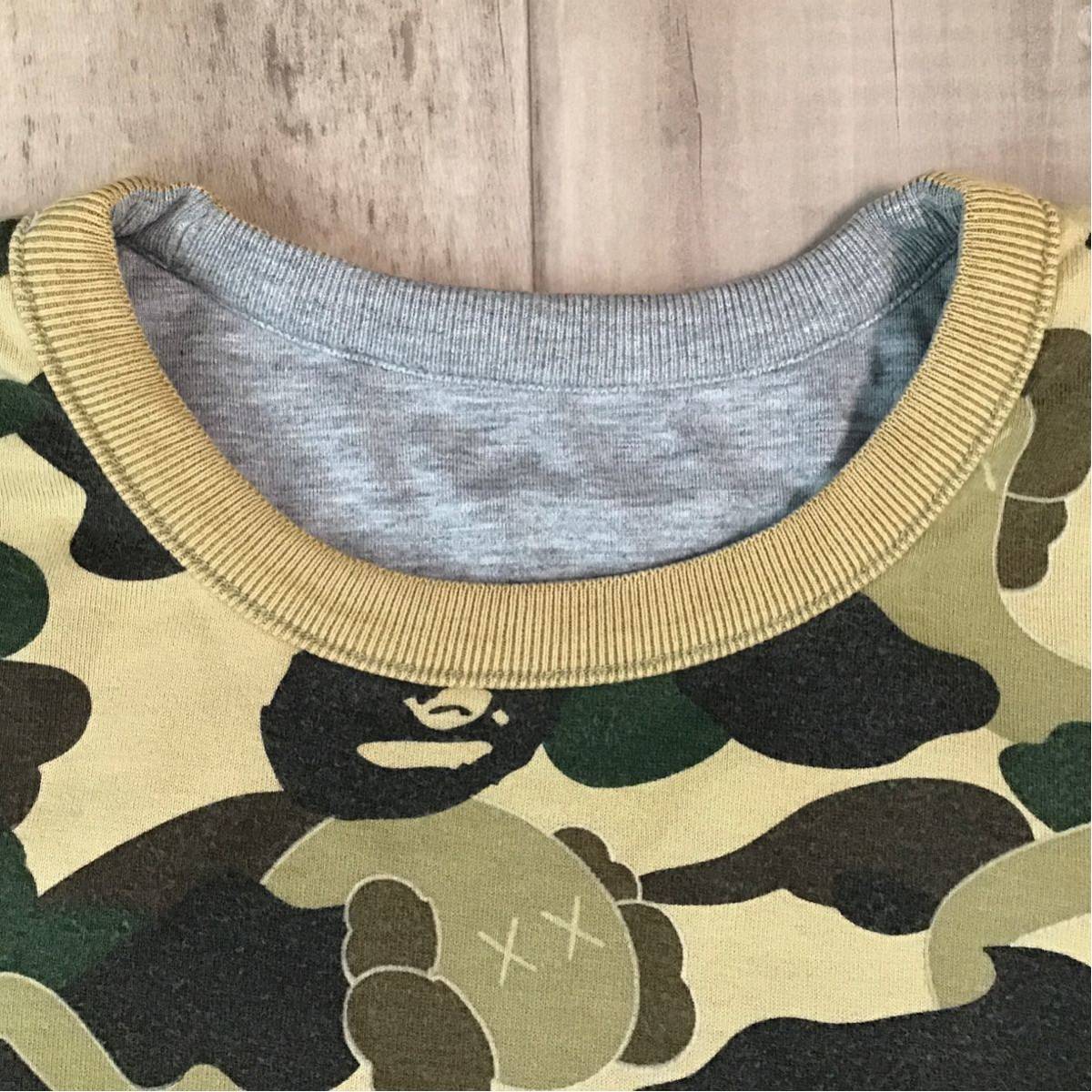 APE BAPE KAWS 1st Camo カレッジロゴ　ロンt tシャツ　s Bape x Kaws 1st Green Camo NYC College Logo Tee White