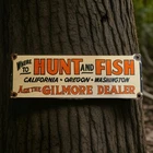 Vintage Gilmore Dealer Porcelain Sign California Oregon Washington Hunt Fish USA
